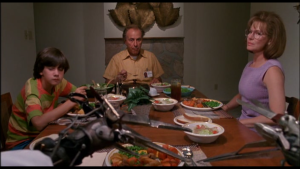 In Edward Scissorhands, the title character looks at his new family from across the dinner table.