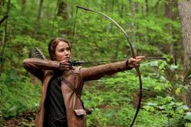 This shot from Hunger Games captures Katniss from the waist up, focusing on her actions as much as her expression.